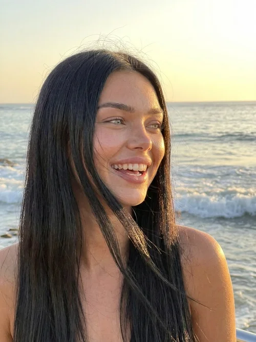 Laughing on the beach at golden hour